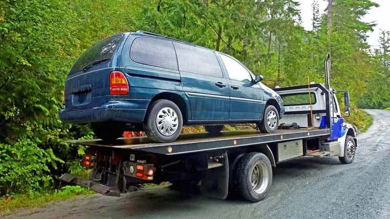 Surrey flatbed towing a cargo van
