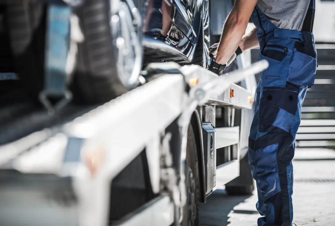 Surrey tow truck driver loading a car onto a flatbed